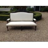 A 19TH CENTURY OAK AND CALICO UPHOLSTERED SETTEE The finely carved oak frame centred with a