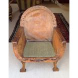 AN EARLY 20TH CENTURY CHILD'S TUB ARMCHAIR  In tan leather upholstery.