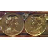 A PAIR OF ANTIQUE BRASS PORTRAIT ROUNDELS Of male and female theatrical characters in profile,