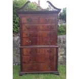 A LATE 18TH CENTURY MAHOGANY CHEST ON CHEST The carved and pierced swan neck pediment above two