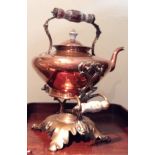 A LARGE 19TH CENTURY COPPER SPIRIT KETTLE Of squat form, having ceramic handles, finials and