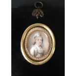 AN EARLY 19TH CENTURY IVORY PORTRAIT MINIATURE Of a lady wearing a white period dress and a light