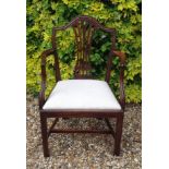 A 19TH CENTURY MAHOGANY OPEN ARMCHAIR With a vase splat back and scrolling arms.