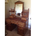 A GOOD VICTORIAN FIGURED OLIVE WOOD DRESSING TABLE Of architectural form, the central mirror flanked