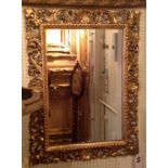 A LATE 19TH CENTURY GILT WOOD FRAMED FLORENTINE MIRROR. (62cm x 75cm) Condition: good