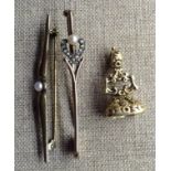 A 19TH CENTURY YELLOW METAL WATCH FOB SEAL Embossed with floral decoration and inset with a baguette