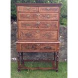 AN EARLY 18TH CENTURY BURR WALNUT AND OAK CHEST ON STAND The two short above four long drawers