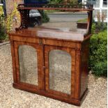 AN EARLY VICTORIAN ROSEWOOD CHIFFONIER  With a pierced gallery above a silvered plate mirrored