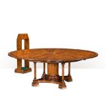 THEODORE ALEXANDER, A FLAME MAHOGANY AND WALNUT BANDED DINING TABLE Of Jupes design, complete with