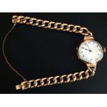 AN EARLY 20TH CENTURY 9CT ROSE GOLD WRISTWATCH Having a white enamel dial with a red number 12 and