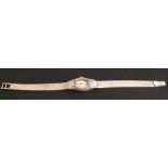 LONGINES, AN ART DECO WHITE PRECIOUS METAL LADIES' WATCH With integral flat weave flexible bracelet,