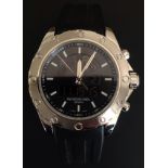 A GENTLEMEN'S RAYMOND WEIL SPORTS WATCH WITH L.C.D. DISPLAY On rubber strap, having date window (