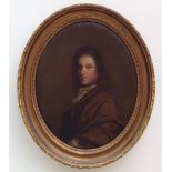 AN 18TH CENTURY OVAL OIL ON CANVAS Portrait of a gentleman wearing a lace collar and brown coat,