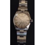 A GENTLEMEN'S ROLEX OYSTER PERPETUAL STAINLESS STEEL WRIST WATCH With satin grey face and having