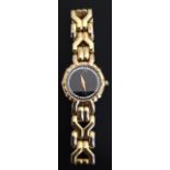 A LADIES' RAYMOND WEIL GOLD PLATED WRIST WATCH With black circular dial surrounded with crystals.