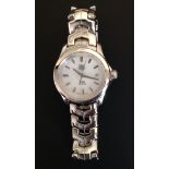 A LADIES' TAG HEUER STAINLESS STEEL WRIST WATCH Having mother-of-pearl face, cased and boxed. (Case: