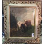 A 19TH CENTURY OIL ON CANVAS Portrait of two cows grazing in a duck egg blue and gilt painted frame,