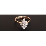 AN 18CT GOLD, DIAMOND SET FLORAL CLUSTER RING Marked '750' (size R). (5771/BG1120827/4)