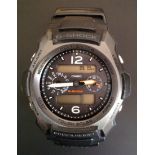 A GENTLEMEN'S CASIO 'G-SHOCK' SPORTS WATCH ON RUBBER STRAP Having L.C.D. display and luminous hands,