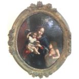 AN 18TH CENTURY ITALIAN SCHOOL OIL ON CANVAS Madonna and child, contained in a carved gilt wood