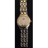 A LADIES' OMEGA DE VILLE STAINLESS STEEL AND GILT WRIST WATCH With integral bracelet and abstract