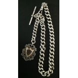 A HEAVY ENGLISH HALLMARKED SILVER ALBERT CHAIN Hung with a blank shield medallion. (chain 39cm,