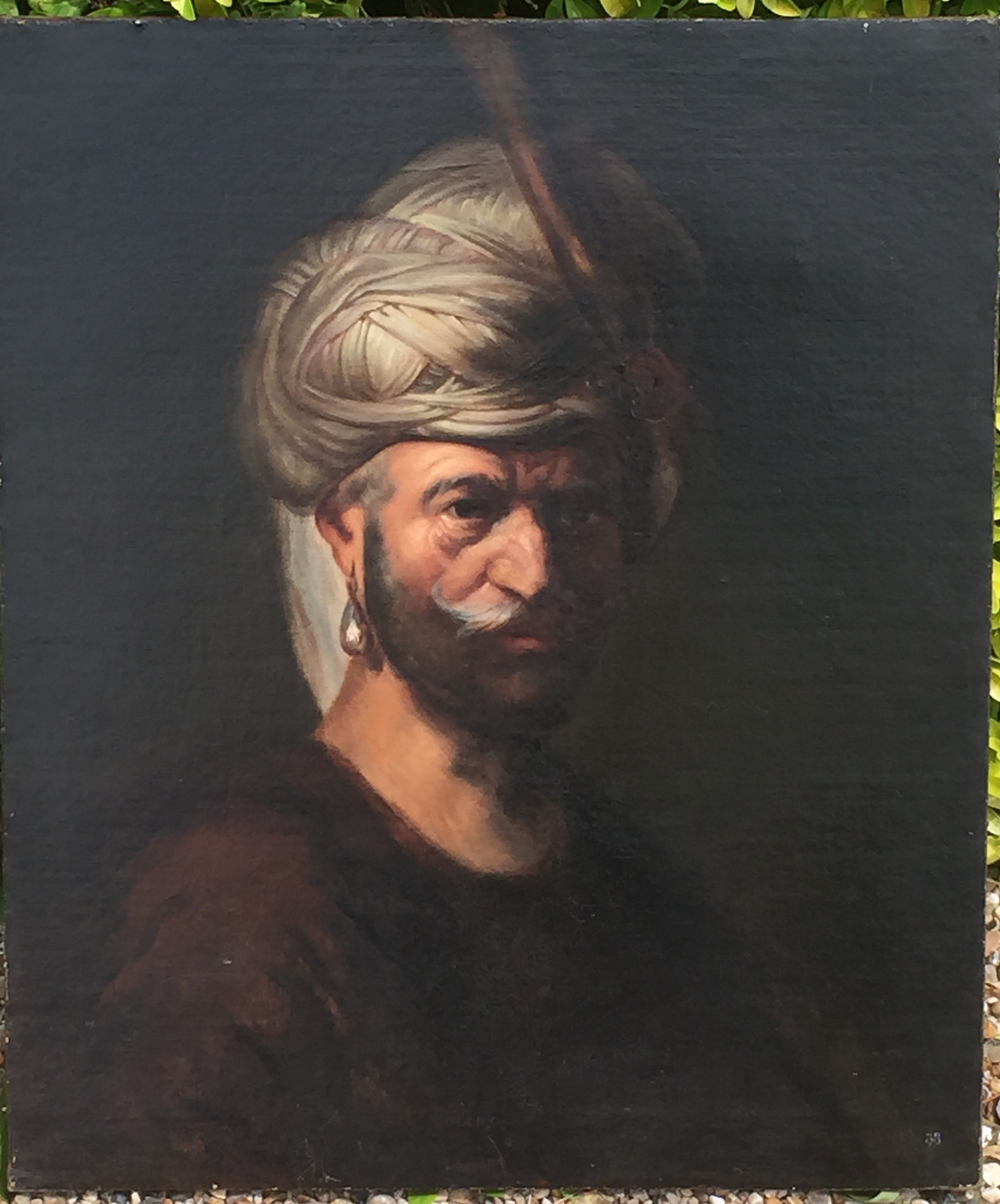 FOLLOWER OF REMBRANDT, A 19TH CENTURY OIL ON CANVAS Portrait of a man wearing a turban.  (61cm x