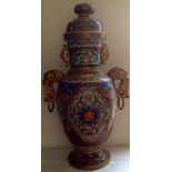 AN EARLY 20TH CENTURY CHINESE  CLOISONNÉ VASE AND COVER Having floral decoration on a red and