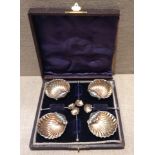 A CHESTER HALLMARKED SILVER EIGHT PIECE CONDIMENT SET To include four shell form salts, with gilt