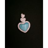 AN 18CT WHITE GOLD, TURQUOISE AND DIAMOND PENDANT In the form of three graduated hearts, the two