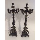 A PAIR OF EARLY 19TH CENTURY FRENCH BRONZE SIX BRANCH CANDELABRAS With scroll work arms and