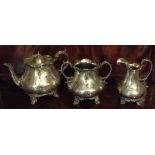 A VICTORIAN THREE PIECE HALLMARKED SILVER TEA SERVICE The teapot having a scalloped edge and