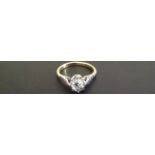 AN 18CT GOLD AND PLATINUM CLAW SET DIAMOND SOLITAIRE RING Diamond weight 0.57ct (size L/M). (5021/