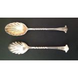 A PAIR OF VICTORIAN HALLMARKED SILVER SPOONS Having scallop shaped bowls and decorative finials,