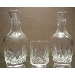 WATERFORD, A PAIR OF CRYSTAL GLASS WATER JUGS Having hobnail design cuts and flutes, together with a