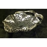 AN EARLY 20TH CENTURY HALLMARKED SILVER SWEETMEAT BASKET Having a swinging carry handle and a