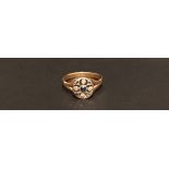 AN 18CT GOLD, SAPPHIRE AND DIAMOND DRESS RING The flat round bezel with a circular cut sapphire,