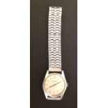 LONGINES, A VINTAGE STAINLESS STEEL WRISTWATCH  Having circular cream dial with silver bar