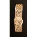 OMEGA, A LADIES' 18CT GOLD BRACELET WATCH With circular dial. (5245/19984/1)