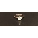 A HALLMARKED 18CT WHITE GOLD AND DIAMOND SOLITAIRE RING The brilliant cut diamond claw set, on solid