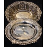 TWO HALLMARKED SILVER BONBON DISHES One of oval form, with embossed floral decoration,