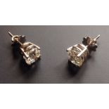A PAIR OF LARGE BRILLIANT CUT DIAMOND STUDS Claw set in unmarked white gold, complete with screw