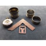 A COLLECTION OF ENGLISH SILVER ITEMS To include pocket watch, napkin rings, Masonic medal.