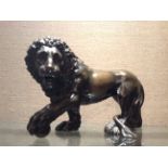 A 19TH CENTURY ITALIAN BRONZE ANIMALIER FIGURE OF A MEDICI STYLE LION With long flowing mane and