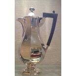 AN EDWARDIAN HALLMARKED SILVER OCTAGONAL WATER JUG Having an Art Deco style body, an ebony handle