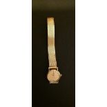 OMEGA, A 9CT GOLD LADIES' WRISTWATCH Having a circular dial, bar markers and gold hands, on an