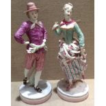 A PAIR 19TH CENTURY GERMAN PORCELAIN FIGURES Ice skaters, a gentleman wearing a lilac jacket and a