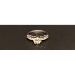 AN 18CT WHITE GOLD AND DIAMOND SOLITAIRE RING The central old brilliant cut diamond set in