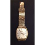 OMEGA, A GOLD PLATED GENTLEMEN'S WRISTWATCH Having a square case, silver tone dial, gilt number