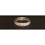 A HALLMARKED 18CT WHITE GOLD AND DIAMOND FULL ETERNITY RING The continuous band of small brilliant